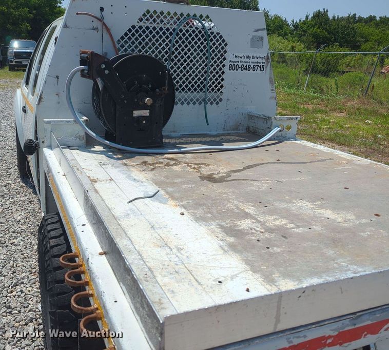 image for item MX9330 2015 Nissan Frontier  King Cab flatbed pickup truck