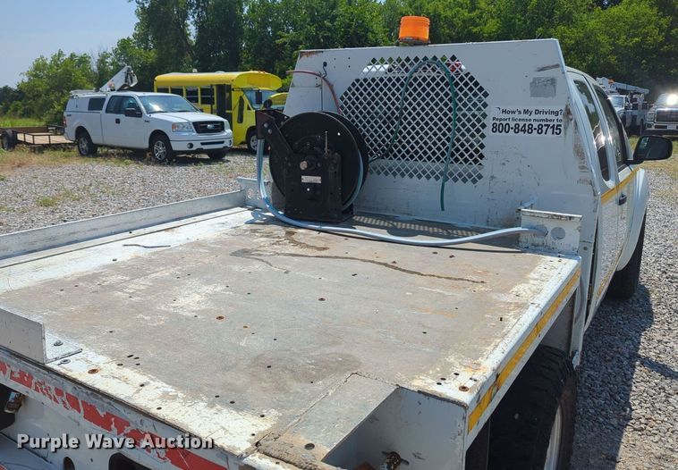 image for item MX9330 2015 Nissan Frontier  King Cab flatbed pickup truck