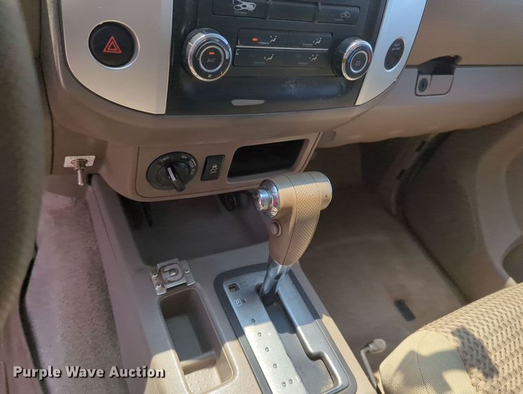 image for item MX9330 2015 Nissan Frontier  King Cab flatbed pickup truck