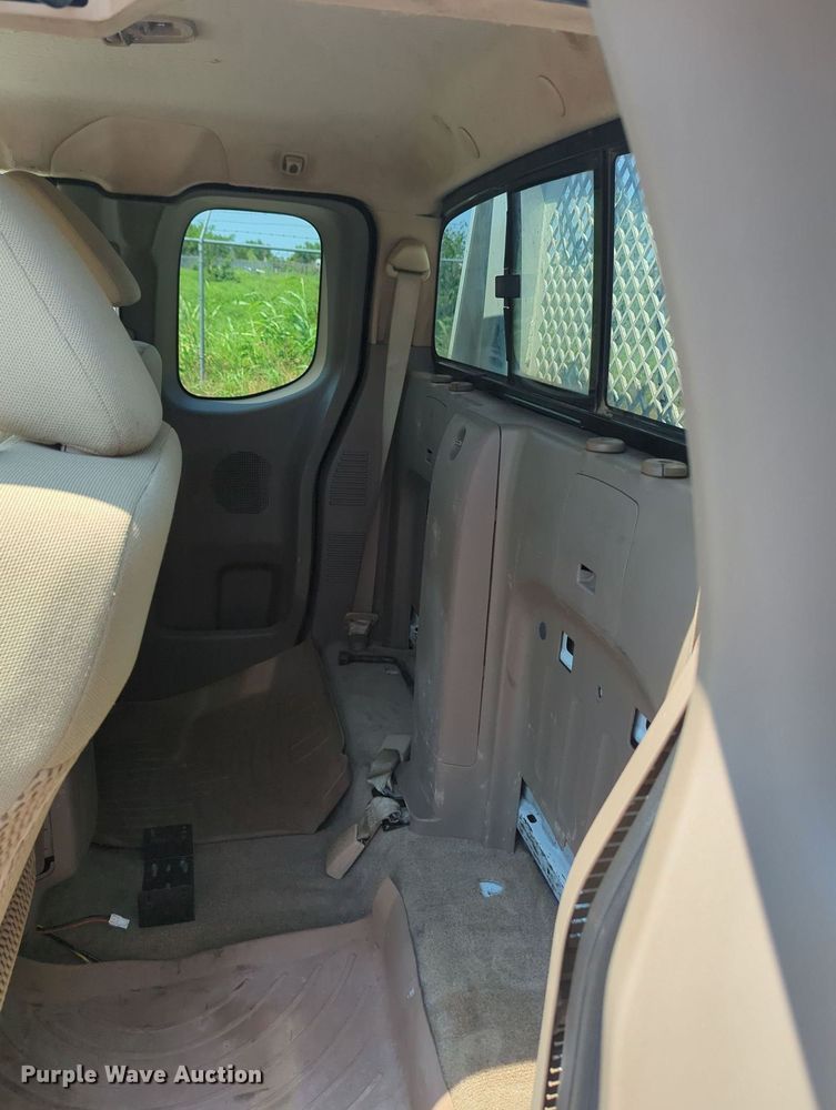 image for item MX9330 2015 Nissan Frontier  King Cab flatbed pickup truck