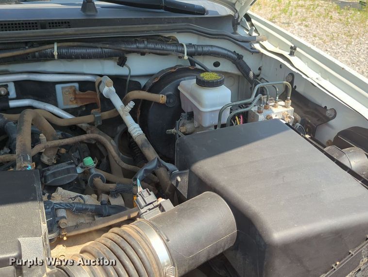 image for item MX9330 2015 Nissan Frontier  King Cab flatbed pickup truck