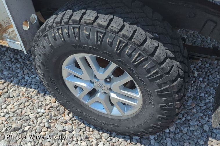 image for item MX9330 2015 Nissan Frontier  King Cab flatbed pickup truck