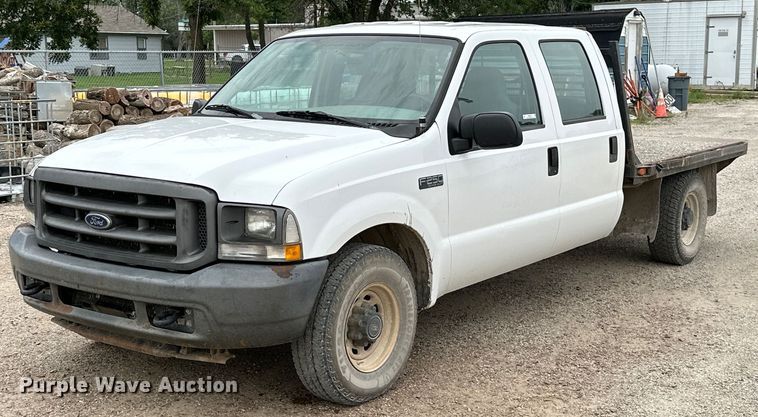 image for item MB9636 2004 Ford F250 Super Duty  Crew Cab flatbed pickup truck