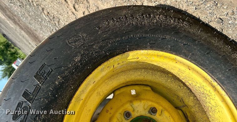 image for item DI7884 2004 John Deere 457 Mega Wide  round baler