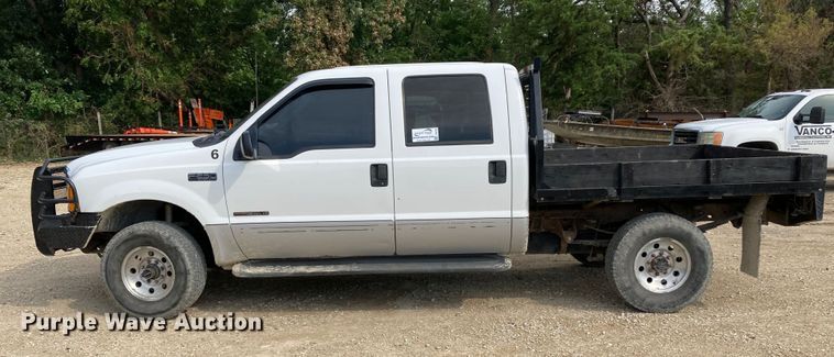 image for item DJ6182 2000 Ford F250 Super Duty XLT  Crew Cab flatbed pickup truck
