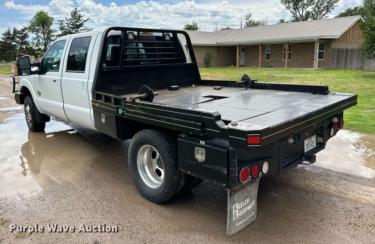 image for item KF9698 2015 Ford F350 Super Duty  Crew Cab bale bed pickup truck