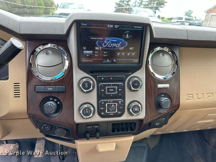 image for item KF9698 2015 Ford F350 Super Duty  Crew Cab bale bed pickup truck