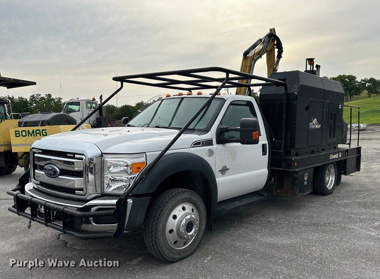 image for item DO5115 2015 Ford F550 Super Duty  flatbed truck with side boom mower