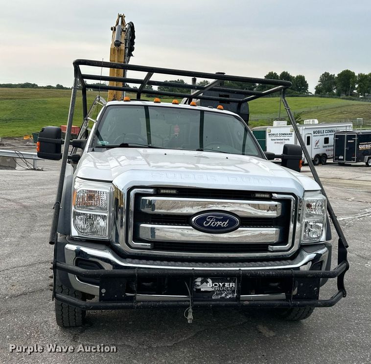 image for item DO5115 2015 Ford F550 Super Duty  flatbed truck with side boom mower
