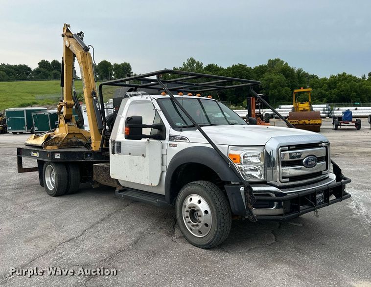 image for item DO5115 2015 Ford F550 Super Duty  flatbed truck with side boom mower
