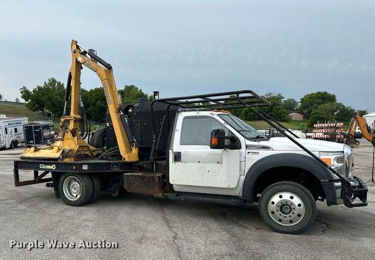 image for item DO5115 2015 Ford F550 Super Duty  flatbed truck with side boom mower