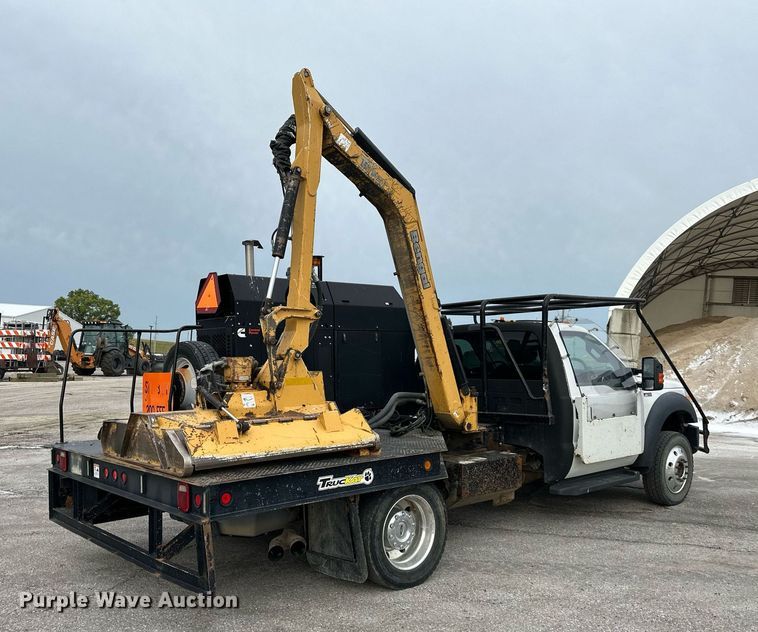 image for item DO5115 2015 Ford F550 Super Duty  flatbed truck with side boom mower