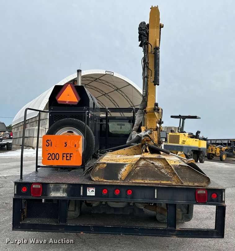 image for item DO5115 2015 Ford F550 Super Duty  flatbed truck with side boom mower