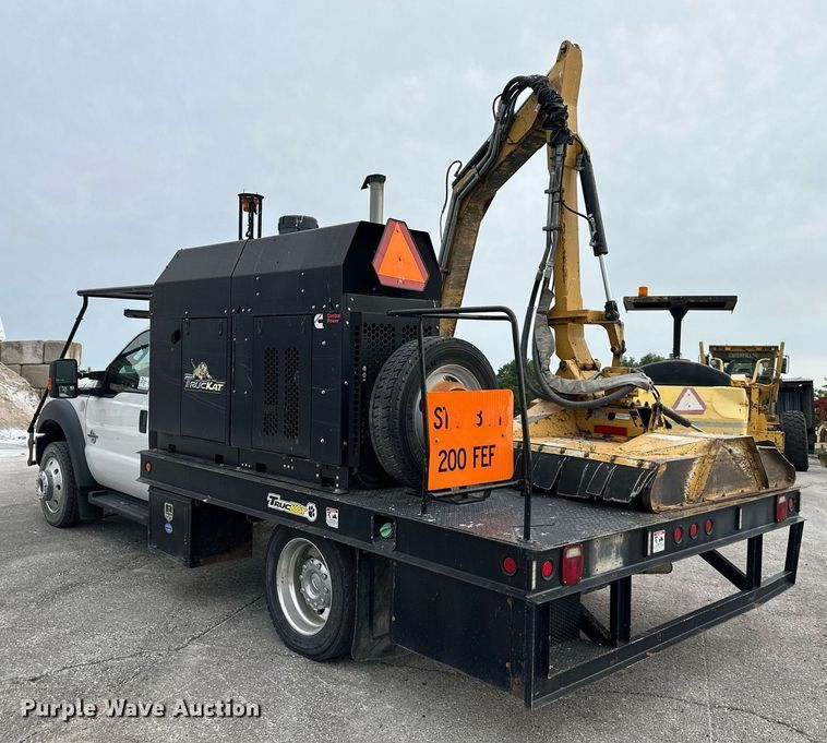 image for item DO5115 2015 Ford F550 Super Duty  flatbed truck with side boom mower