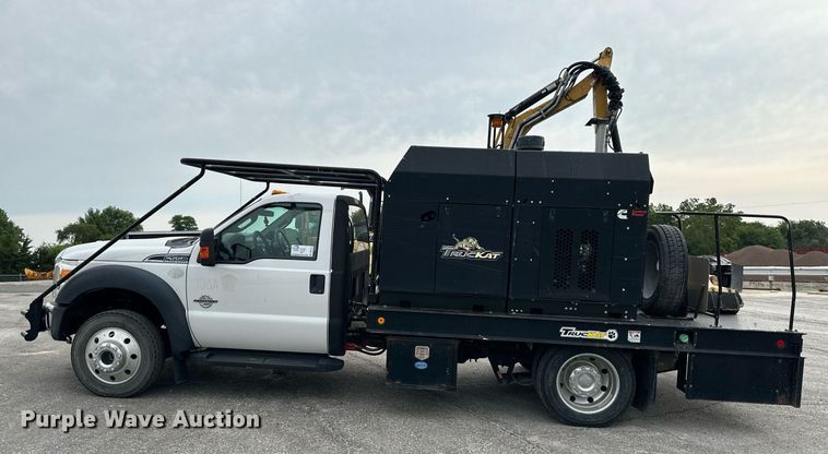 image for item DO5115 2015 Ford F550 Super Duty  flatbed truck with side boom mower