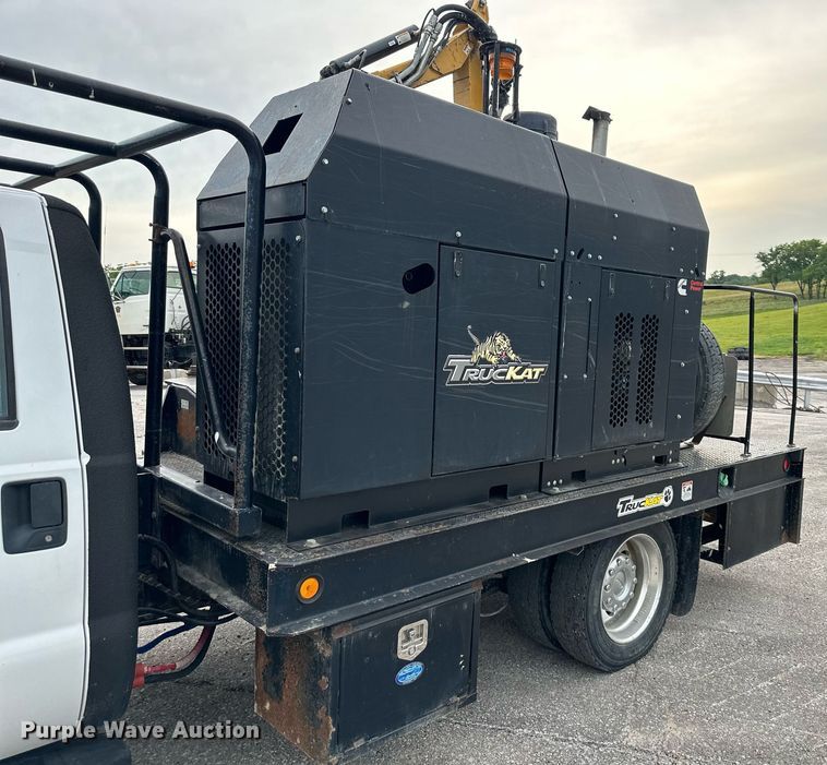 image for item DO5115 2015 Ford F550 Super Duty  flatbed truck with side boom mower