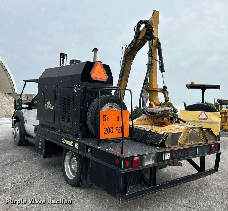 image for item DO5115 2015 Ford F550 Super Duty  flatbed truck with side boom mower