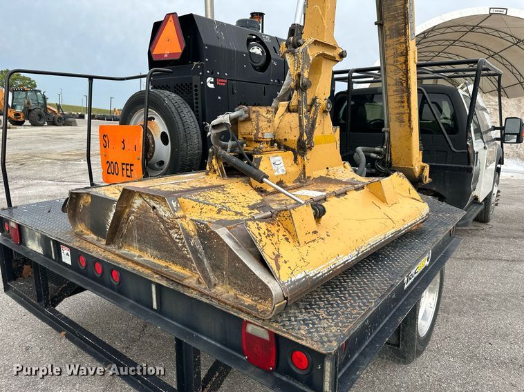 image for item DO5115 2015 Ford F550 Super Duty  flatbed truck with side boom mower
