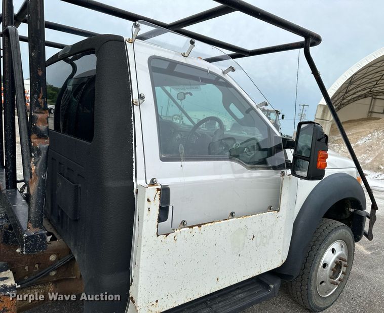 image for item DO5115 2015 Ford F550 Super Duty  flatbed truck with side boom mower