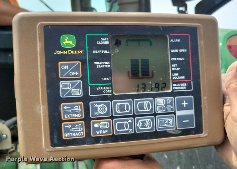 image for item DN4008 John Deere 569 Mega Wide Plus  round baler