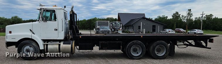 image for item LM9053 1996 Volvo WG  rollback truck