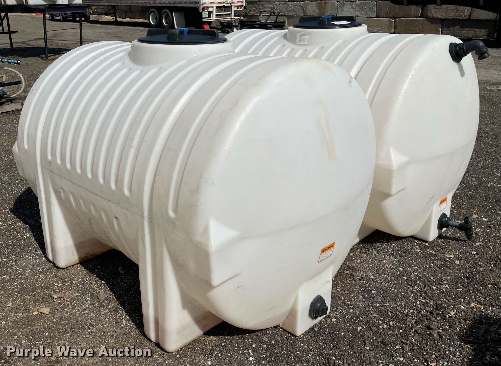 (2) 500 gallon poly tanks in Elgin, IL | Item DL3919 sold | Purple Wave