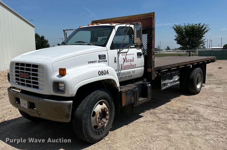 image for item NP9892 1999 GMC C7H042  flatbed truck