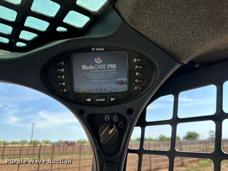 image for item KM9850 2014 Bobcat T750  tracked skid steer loader