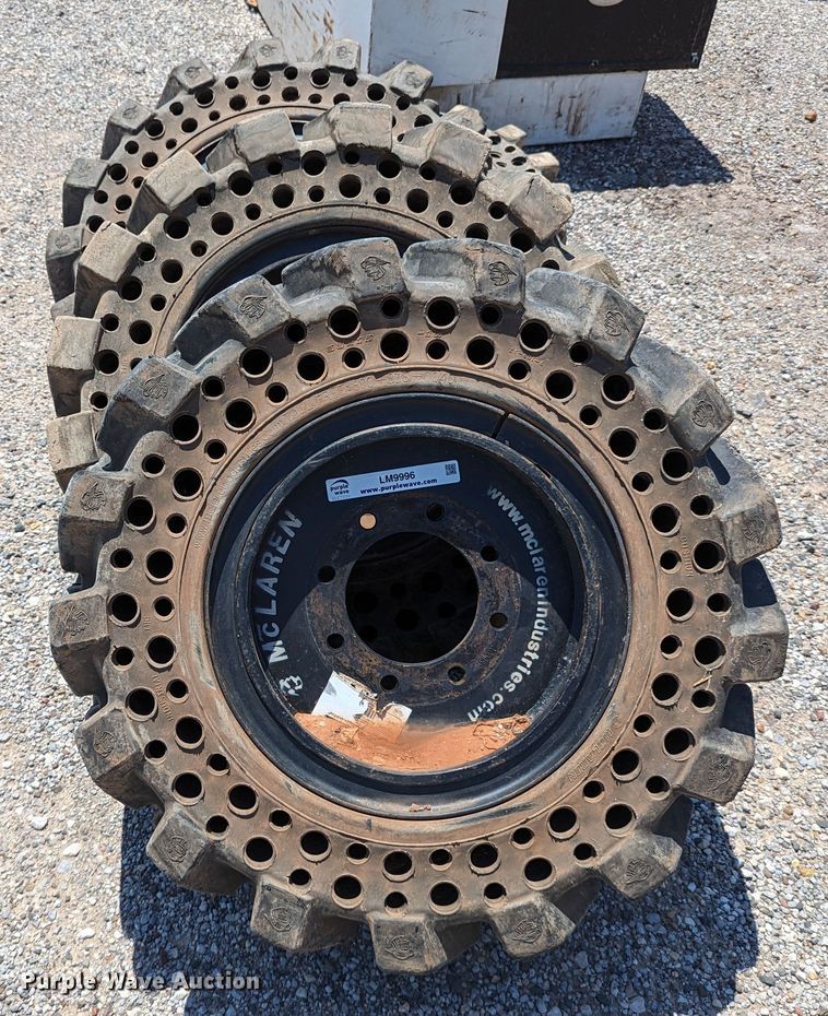 image for item LM9996 (4) McLaren 33x12-16 solid tires and wheels