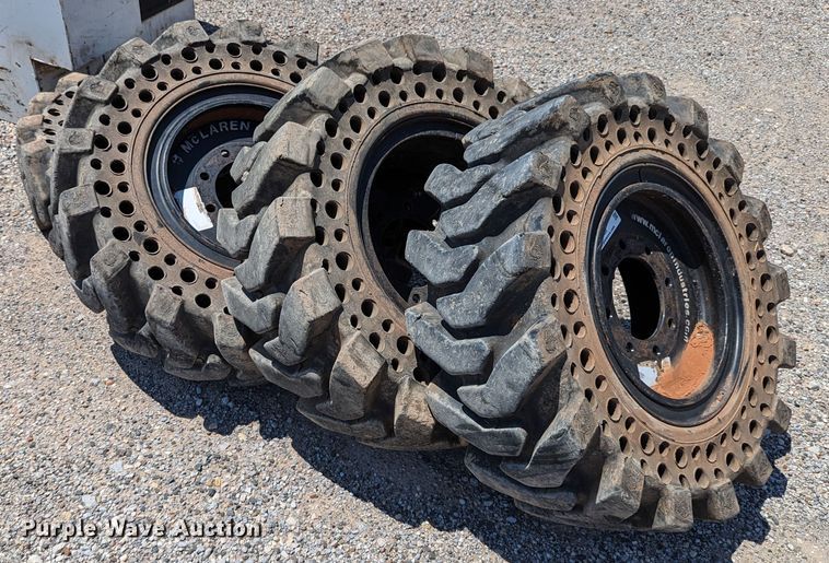 image for item LM9996 (4) McLaren 33x12-16 solid tires and wheels