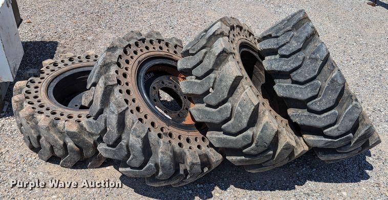 image for item LM9996 (4) McLaren 33x12-16 solid tires and wheels