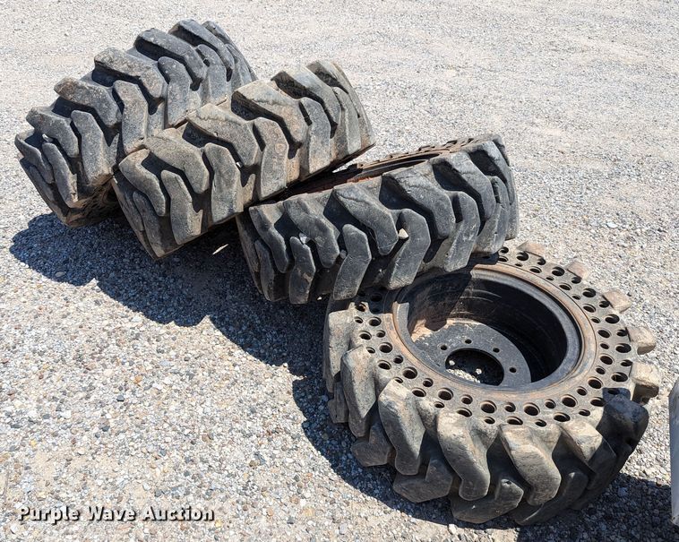 image for item LM9996 (4) McLaren 33x12-16 solid tires and wheels