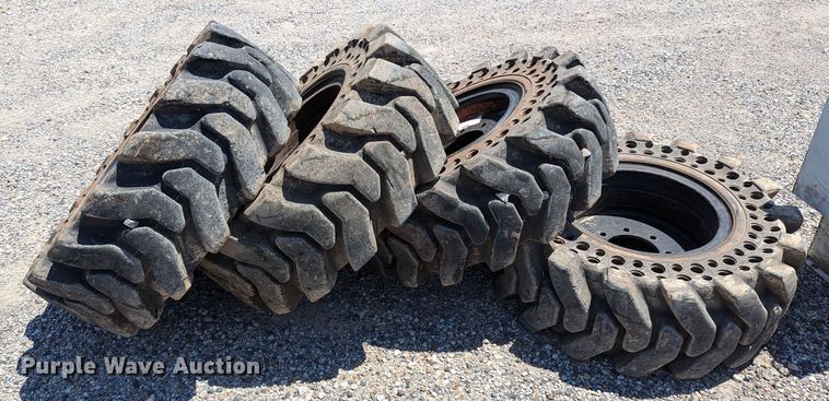 image for item LM9996 (4) McLaren 33x12-16 solid tires and wheels