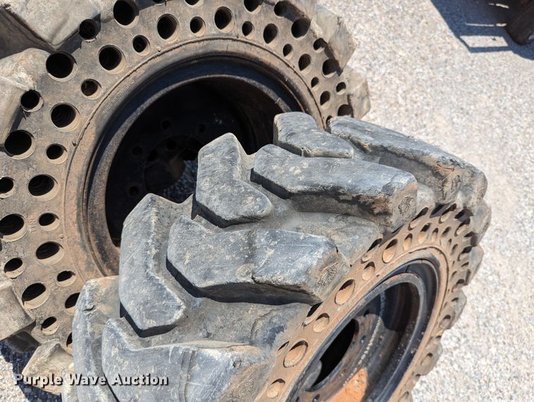 image for item LM9996 (4) McLaren 33x12-16 solid tires and wheels