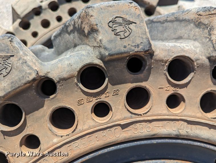 image for item LM9996 (4) McLaren 33x12-16 solid tires and wheels