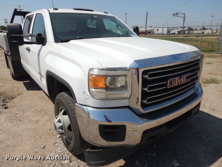 image for item DO3082 2015 GMC Sierra 3500HD  Crew Cab flatbed pickup truck