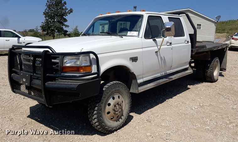 image for item DO3132 1995 Ford F350 XLT  Crew Cab flatbed pickup truck