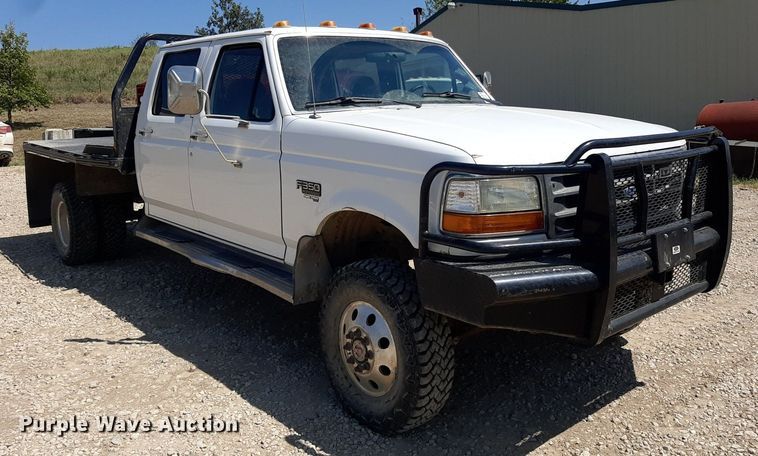image for item DO3132 1995 Ford F350 XLT  Crew Cab flatbed pickup truck