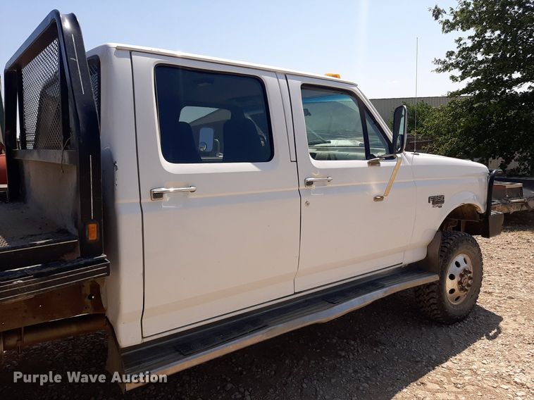 image for item DO3132 1995 Ford F350 XLT  Crew Cab flatbed pickup truck
