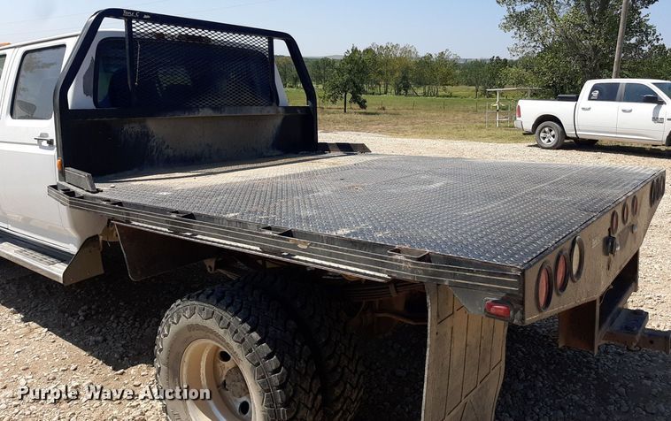 image for item DO3132 1995 Ford F350 XLT  Crew Cab flatbed pickup truck
