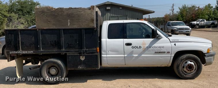 image for item NT9533 2001 Dodge Ram 3500  Quad Cab flatbed pickup truck