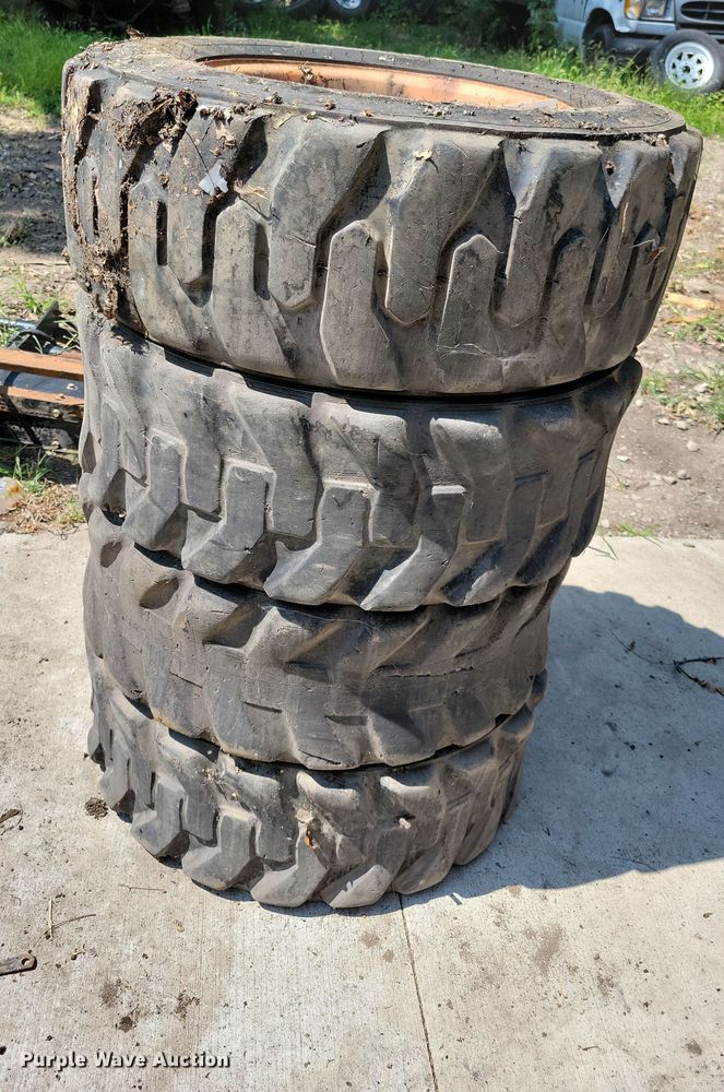image for item DN4080 (4) 10-16.5 NHS Firestone skid steer tires and wheels