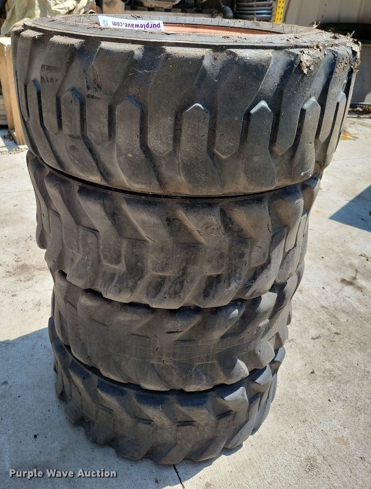 image for item DN4080 (4) 10-16.5 NHS Firestone skid steer tires and wheels