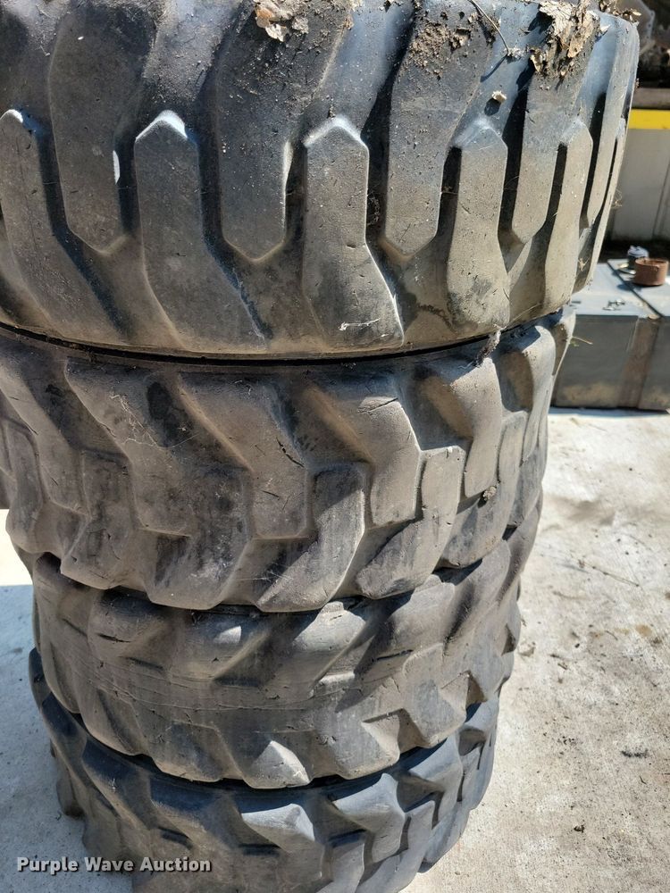 image for item DN4080 (4) 10-16.5 NHS Firestone skid steer tires and wheels