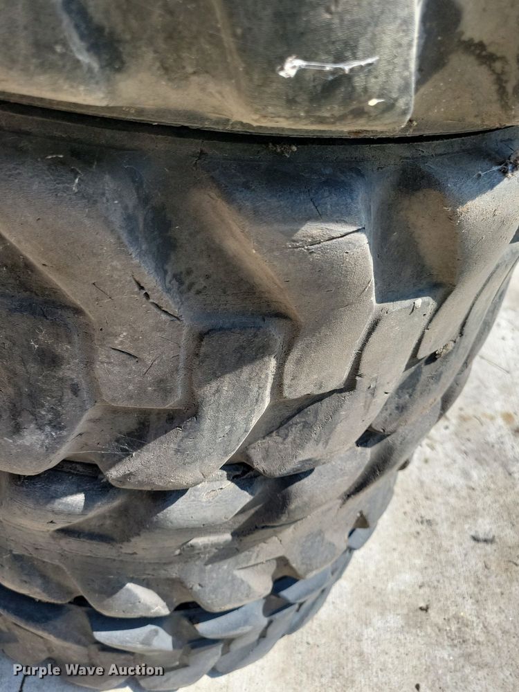 image for item DN4080 (4) 10-16.5 NHS Firestone skid steer tires and wheels