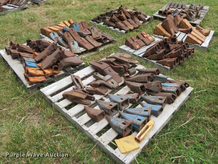image for item NL9514 (7) pallets of excavator bucket teeth