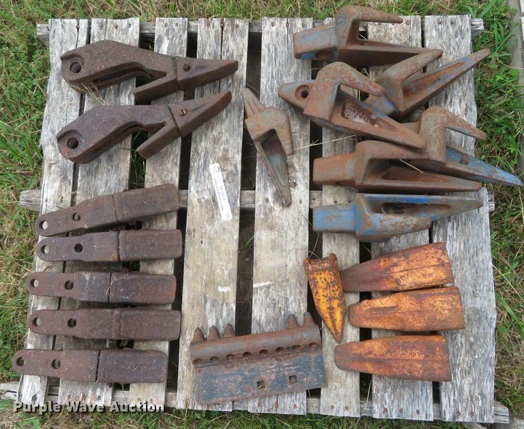 image for item NL9514 (7) pallets of excavator bucket teeth