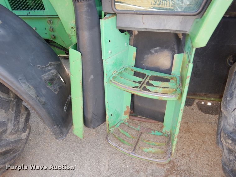 image for item DN8680 1999 John Deere 6310 MFWD tractor