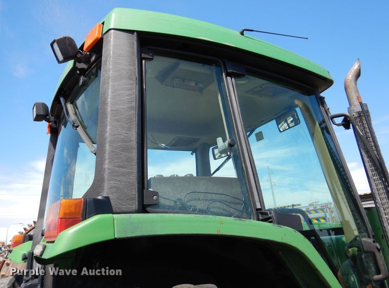 image for item DN8680 1999 John Deere 6310 MFWD tractor