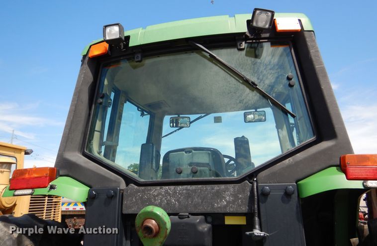 image for item DN8680 1999 John Deere 6310 MFWD tractor